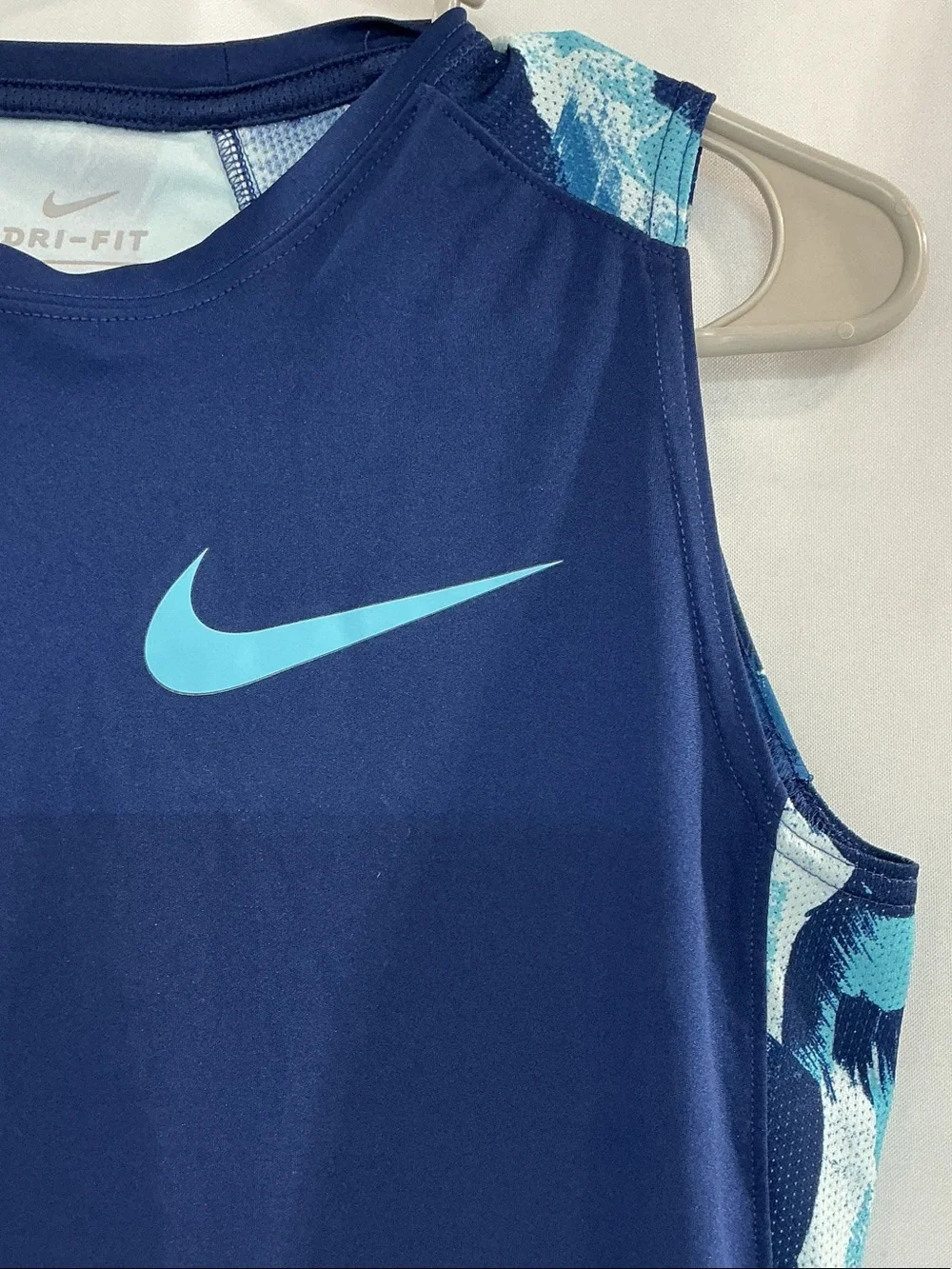 Nike Men’s Navy Tank Top with Light Blue Swoosh and Patterned Side Panels